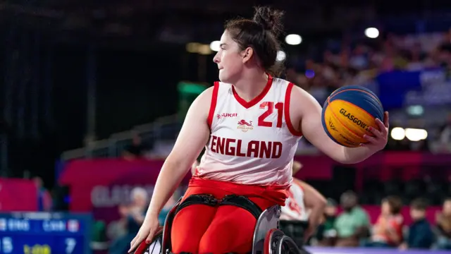 Jade Atkins holds the ball for England in the wheelchair women's 3x3 basketball at the Commonwealth Games in Glasgow 