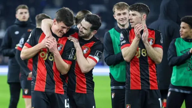 Bournemouth players applauding travelling fans