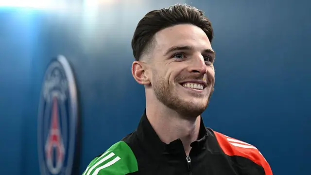 Declan Rice smiles during press conference