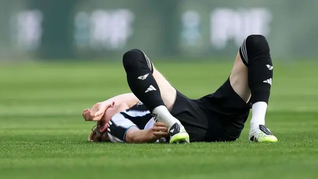  Anthony Gordon of Newcastle United reacts on the floor while holding his leg