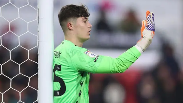 Stoke goalkeeper Tommy Simkin linin-up a defensive wall during a game