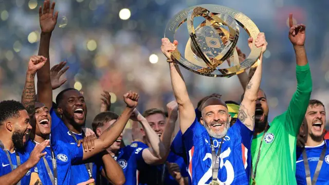 Enzo Maresca holds up Club World Cup trophy