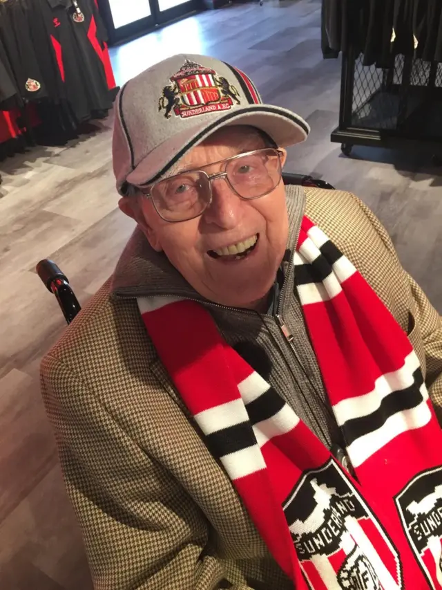 George Forster wearing a Sunderland hat and scarf