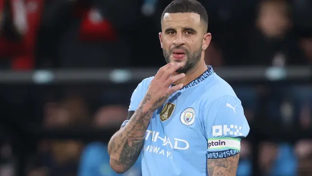 Kyle Walker scratches his chin