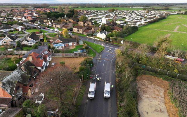 A drone shot of the area where a car crashed into a gas substation in Pagham Road, near Nyetimber. Two vans can be seen in the image alongside a cordon.