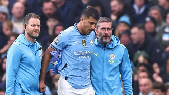 Rodri walks off pitch with medical staff