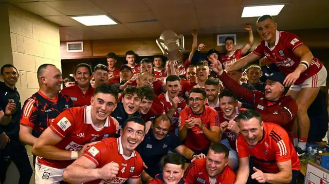 Cork players celebrate with the Mick Mackey Cup