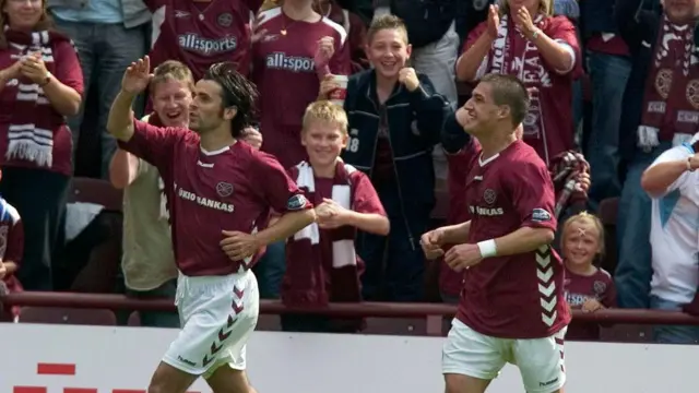 07/08/05 SPL HEARTS V HIBS (4-0) TYNECASTLE - EDINBURGH Paul Hartley (left) celebrates with Hearts team-mate Rudi Skacel after scoring.