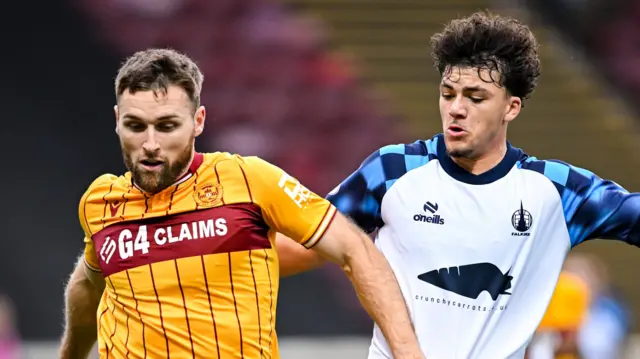 Motherwell's Stephen O'Donnell and Falkirk's Filip Lissah
