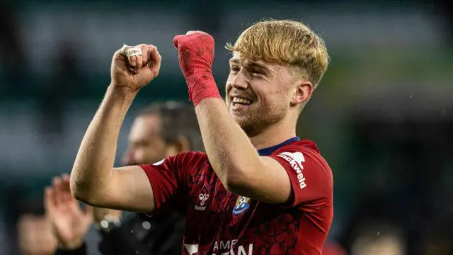 David Watson celebrates at full-time against Celtic