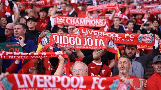 Liverpool fans hold up scarves, including Diogo Jota tribute 