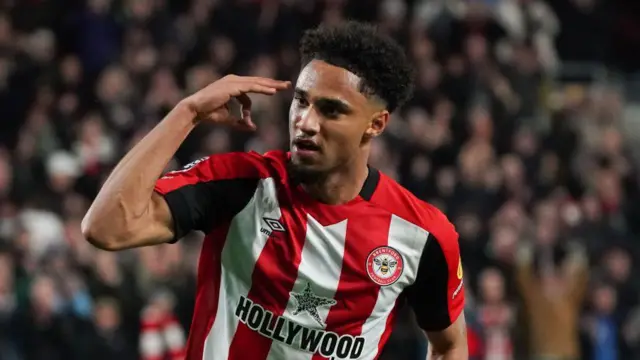 Brentford's Kevin Schade celebrates his hat-trick against Leicester