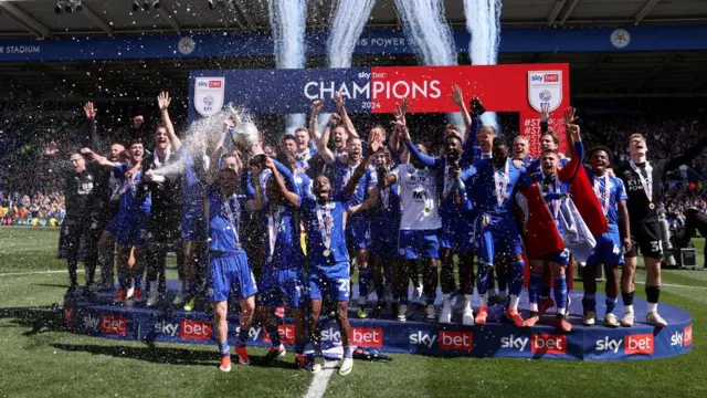 Leicester City lift the Premier League trophy