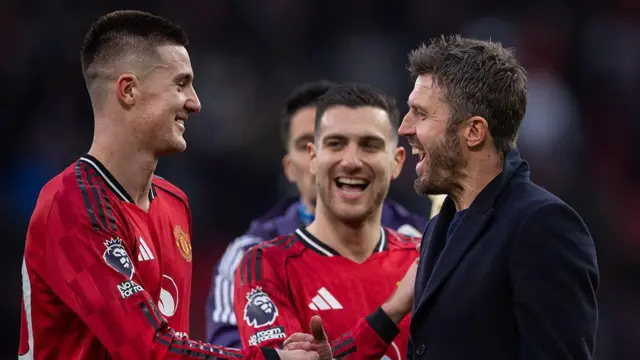 Benjamin Sesko and Michael Carrick embrace