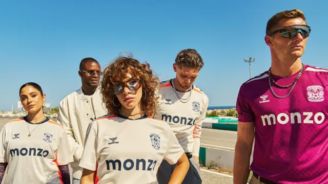 Coventry City's new away kit, including the goalkeeper jersey, being modelled
