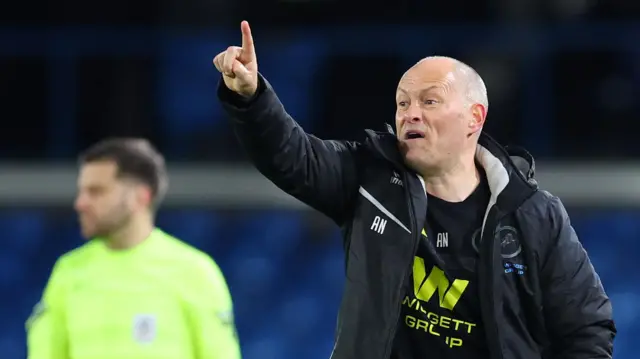 Alex Neil pointing instructions to his Millwall players at Leeds