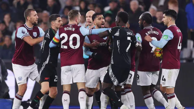 West Ham and Arsenal players clash
