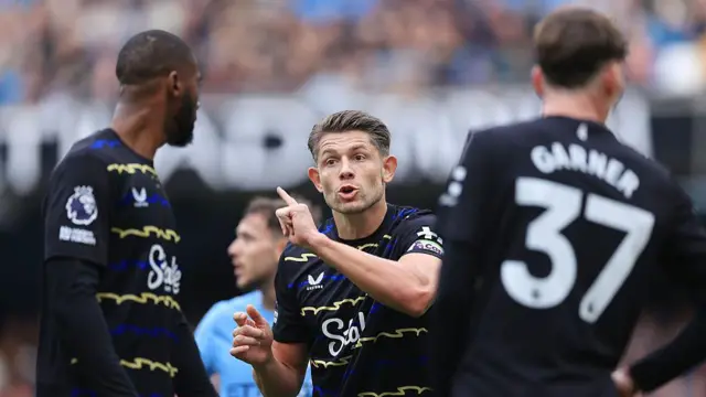James Tarkowski gestures to his team-mates 