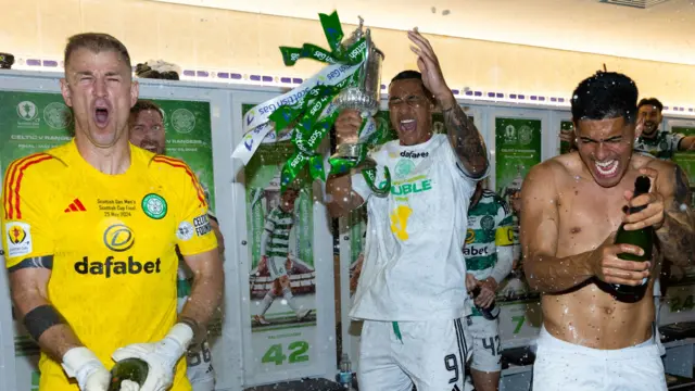 Adam Idah, centre, celebrates Celtic's Scottish Cup win with Joe Hart and Luis Palma