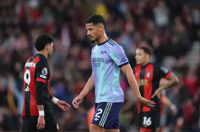 William Saliba walks off the pitch after being sent off versus Bournemouth