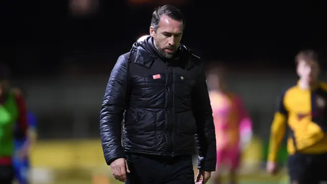 Newport boss Christian Fuchs looks dejected 
