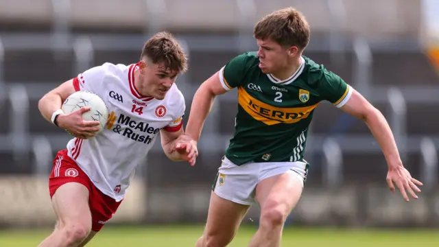 Ruairi McCullagh runs with the ball for Tyrone