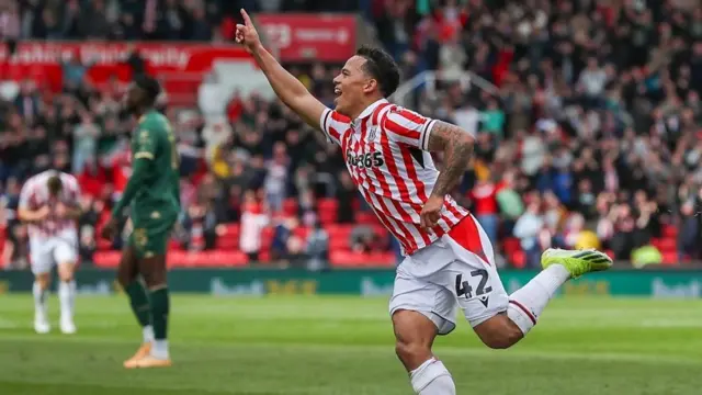 Stoke City winger Million Manhoef celebrating after scoring.