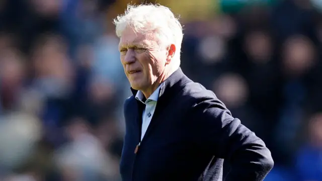 David Moyes stands on the field at Goodison Park