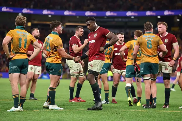 Maro Itoje of British and Irish Lions shakes hands with Carlo Tizzano of Australia.