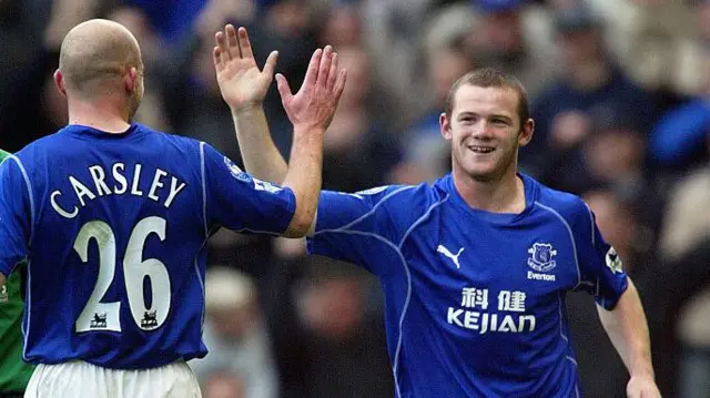 a young Wayne Rooney gives Lee Carsley a high five