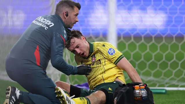 Ollie Rathbone receives treatment from a Wrexham physio