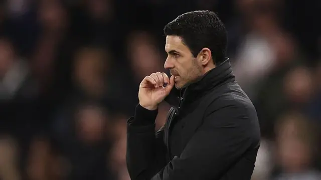 Mikel Arteta looks on thoughtfully during match