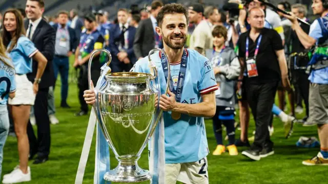 Bernardo Silva of Manchester City celebrates the UEFA Champions league title with his trophy