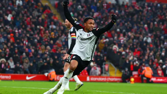 Fulham's Kenny Tete wheels away after scoring at Anfield