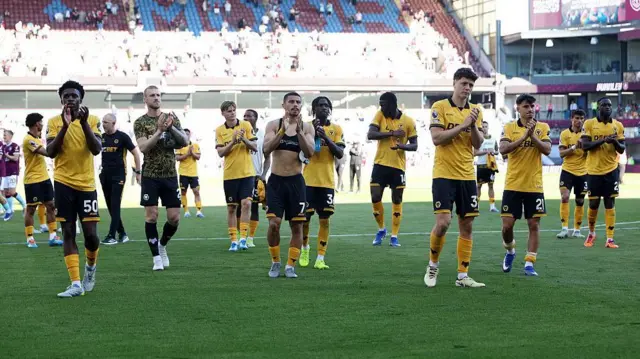 Wolves players applaud fans at Turf Moor