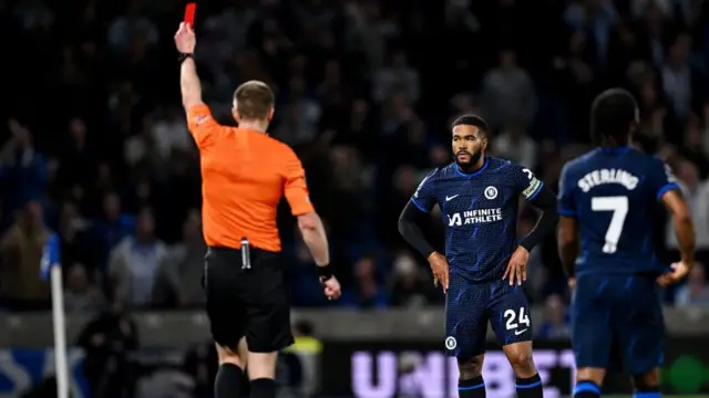 The referee hands Reece James a red card in Chelsea's victory at Brighton in 2023/24.