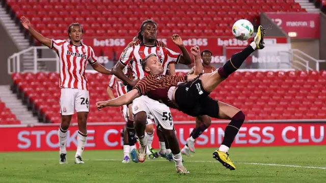 Bradford's Nick Powell attempts a bicycle kick against Stoke