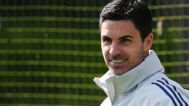 Mikel Arteta smiles during a training session