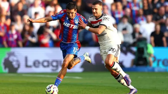 Daniel Munoz of Crystal Palace is challenged by Diogo Dalot of Manchester United during the Premier League match between Crystal Palace FC and Manchester United FC at Selhurst Park