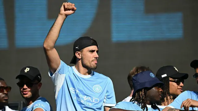 Rodri on the open top bus 
