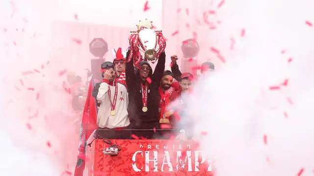 Trent Alexander-Arnold lifting the Premier League trophy