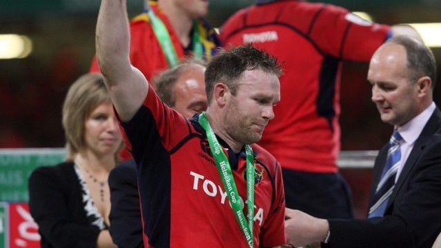 Kelly receives his Heineken Cup medal after victory over Biarritz