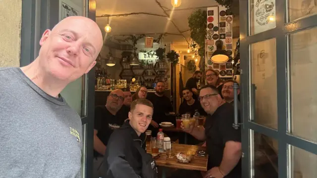 A group of people sat in a local bar in Bilbao