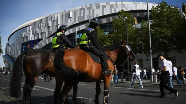 Police on horseback outside Tottenham Hotspur Stadium
