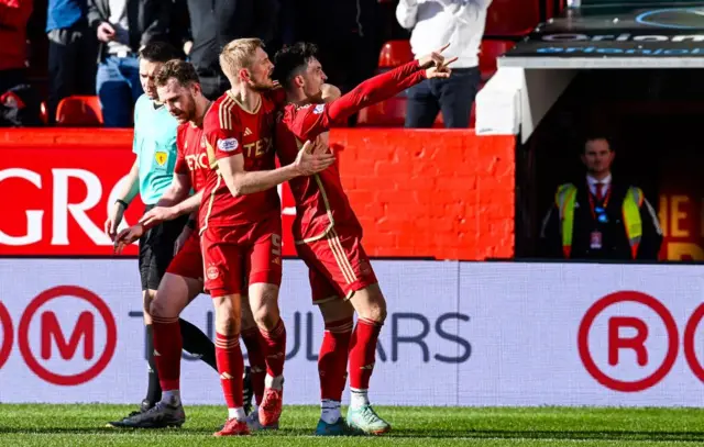 Aberdeen's Jamie McGrath celebrates with Richard Jensen as he scores to make it 2-1 during a cinch Premiership match between Aberdeen and Ross County at Pittodrie Stadium, on March 30, 2024, in Aberdeen, Scotland. 