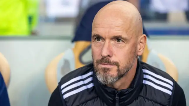 Erik ten Hag sits in the dugout during Manchester United's 3-3 draw with Porto