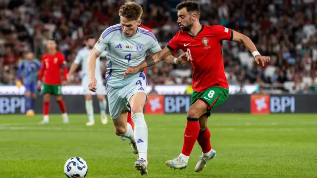 Scotland's Scott McTominay (L) and Portugal's Bruno Fernandes in action during a UEFA Nations League match between Portugal and Scotland at the Estadio da Luz, on September 08, 2024, in Lisbon, Portugal