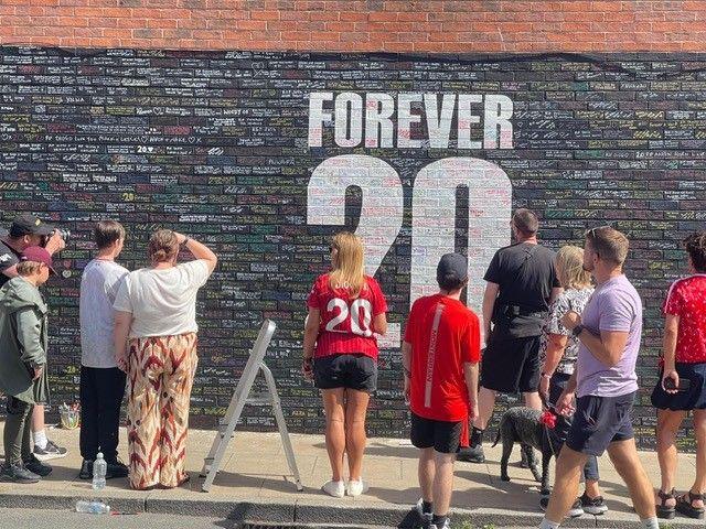 Fans gather at a 'Forever 20' mural dedicated to Diogo Jota