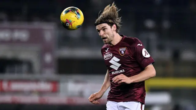  Borna Sosa heads the ball for Torino