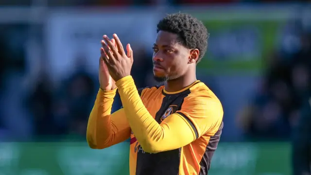 Newport County's Bobby Kamwa applauds fans